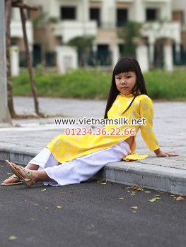 Áo dài gấm Thái Tuấn cho bé gái màu vàng đồng xu nhỏ GTT.6